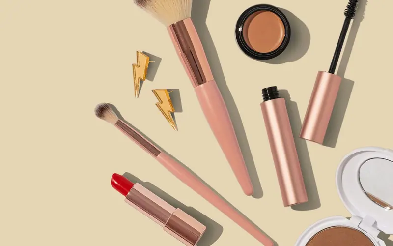 Makeup products arranged flat