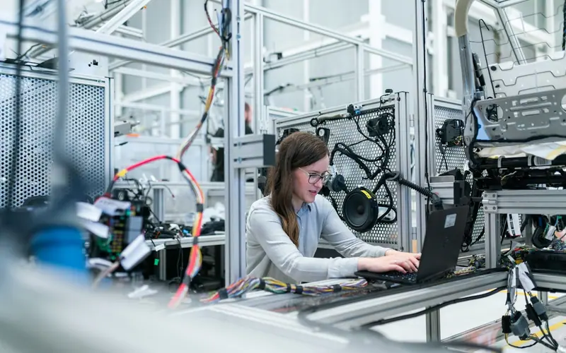 Technician working on an electronics assembly line