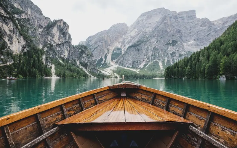 Wooden boat on a mountain lake
